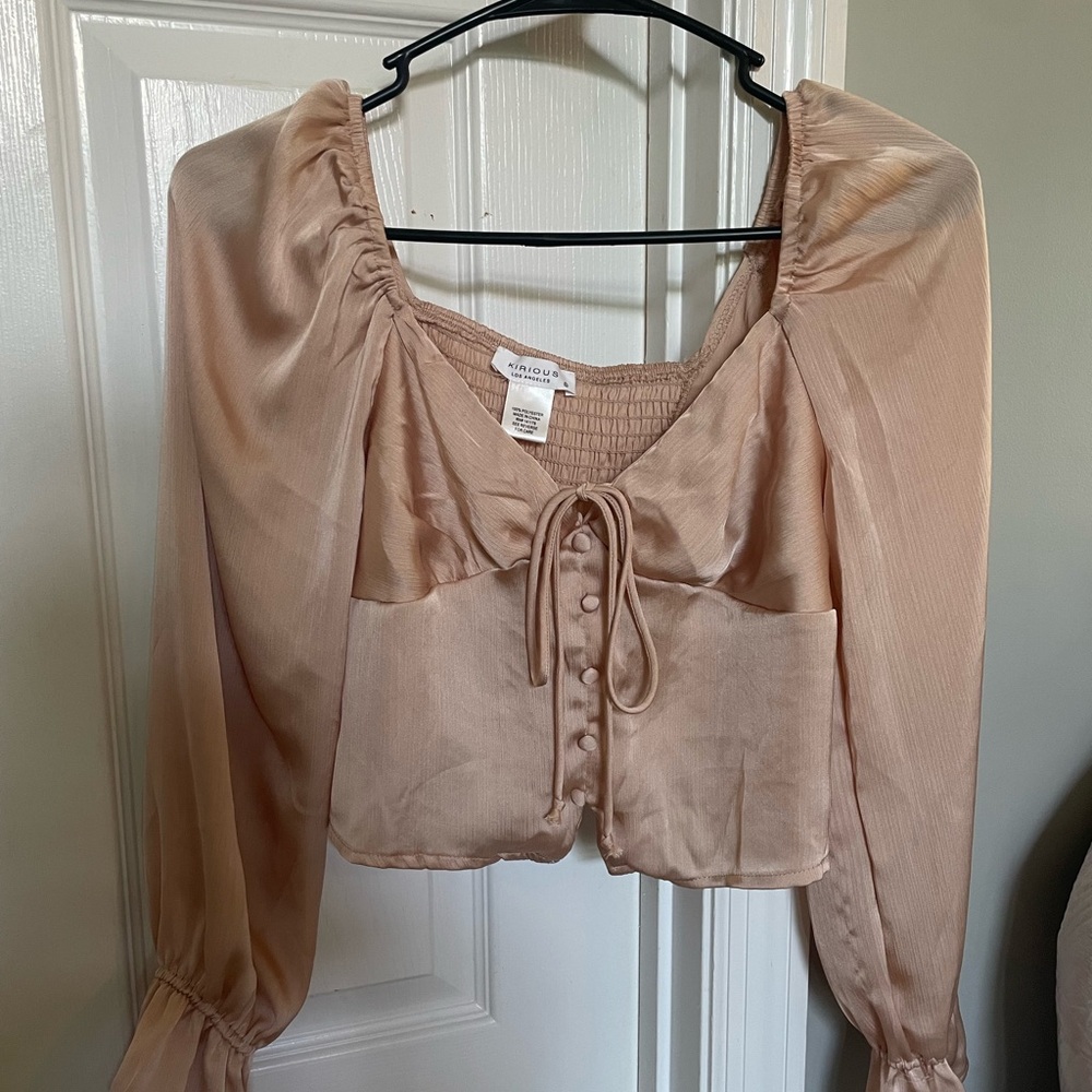 Satin button shirt.